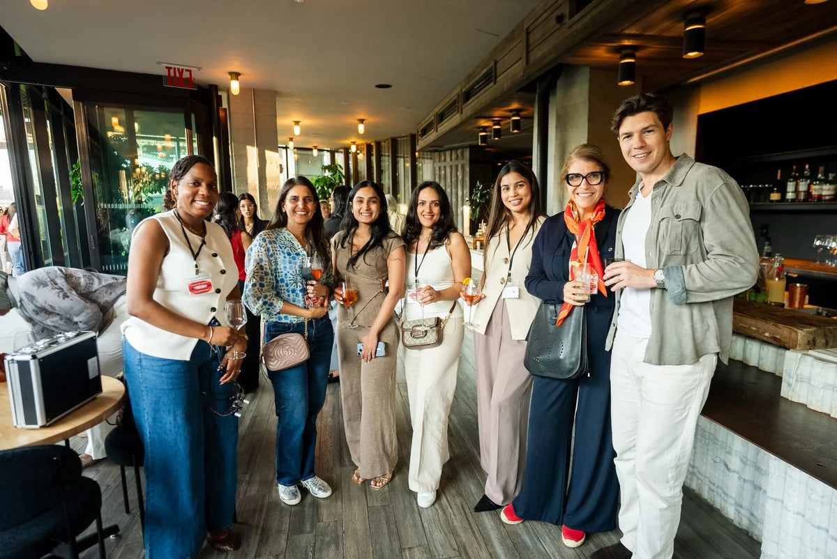 Art of Ceramic attendees and instructors together at the rooftop cocktail party