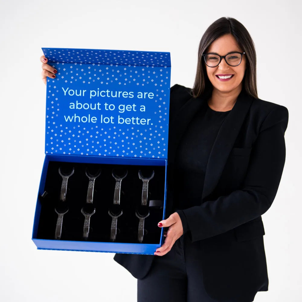 Dr. Andi-Jean Miro holding The Box, the Stribe dental photography kit